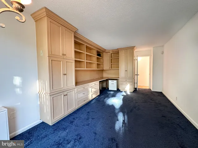 a view of cabinets and wooden floor