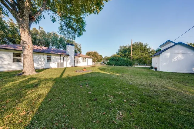 a view of a house with a back yard