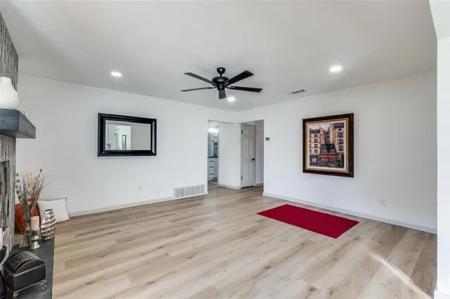 a view of a room with cabinet and wooden floor
