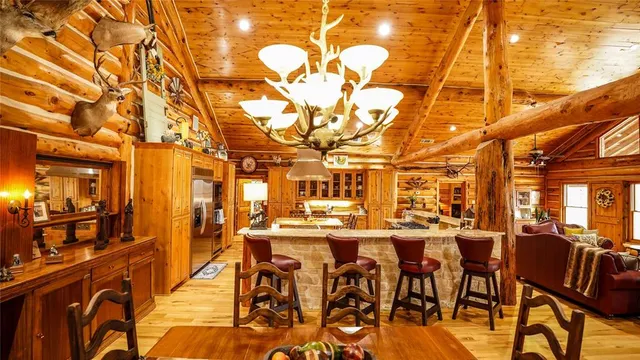 a view of a patio with table and chairs