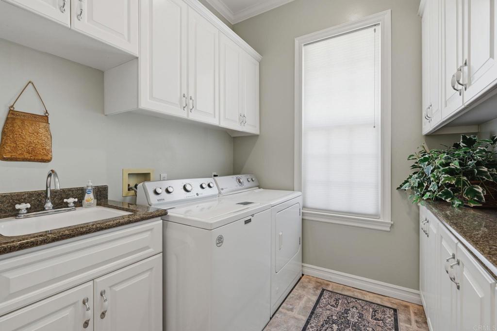 2292 Dos Lomas Fallbrook, CA 92028 - Photo 68 of 71 Laundry room with maytag washer & dryer, folding table and utility sink