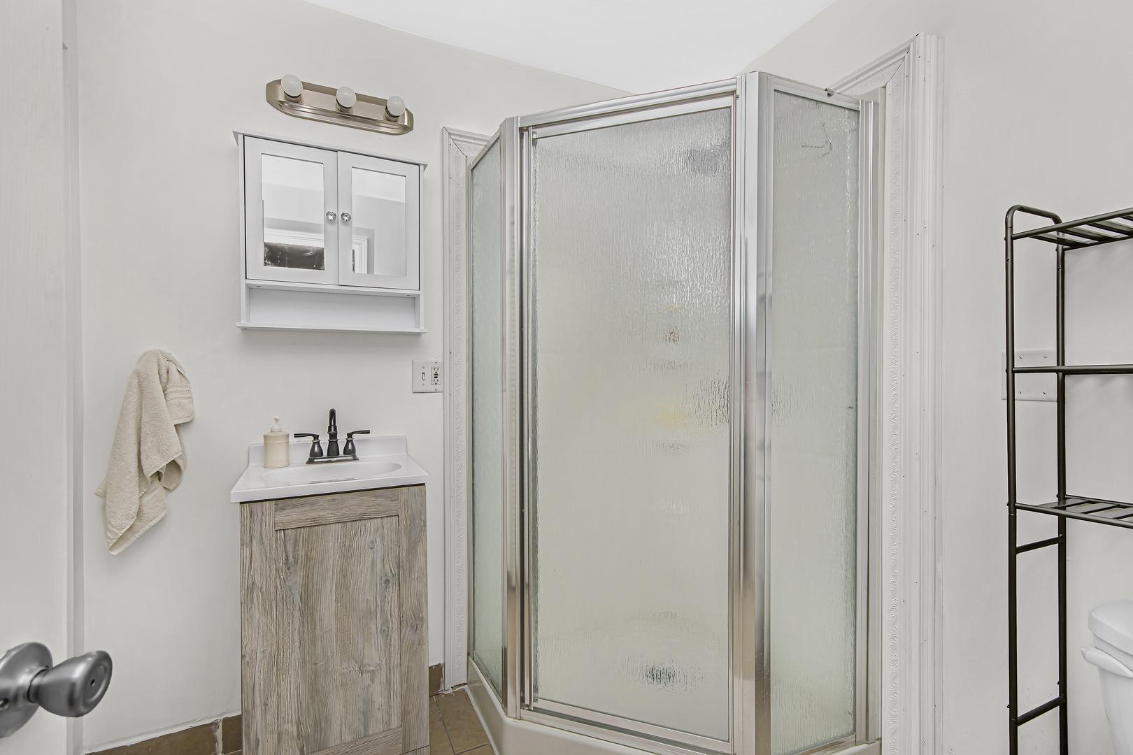 4346 North Pulaski Road, Unit C Chicago, IL 60641 - Photo 15 of 21 a bathroom with a shower a mirror and a sink