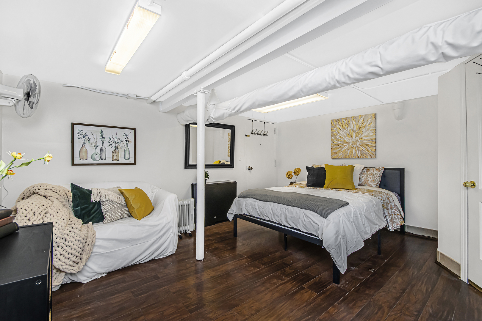 4346 North Pulaski Road, Unit C Chicago, IL 60641 - Photo 17 of 21 a spacious bedroom with a bed and couch