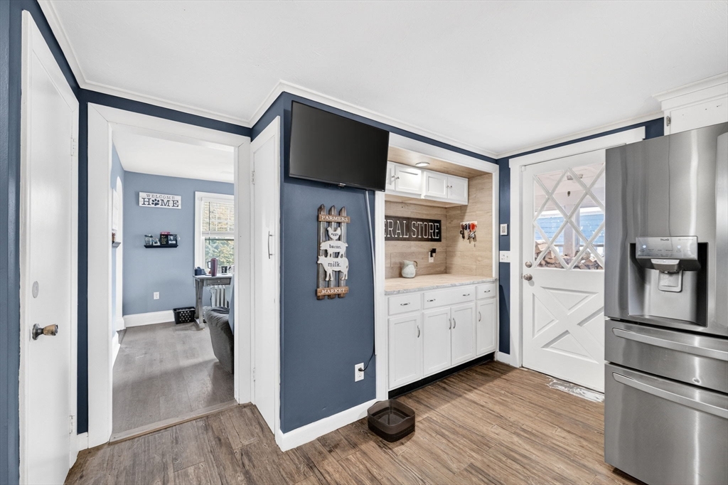 59 Glendale Street Fall River, MA 02720 - Photo 14 of 37 a kitchen with white cabinets and stainless steel appliances