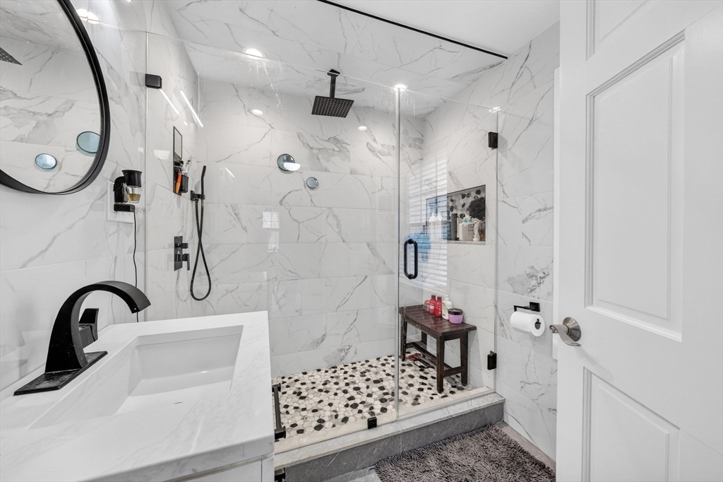 59 Glendale Street Fall River, MA 02720 - Photo 22 of 37 a bathroom with a sink and a mirror