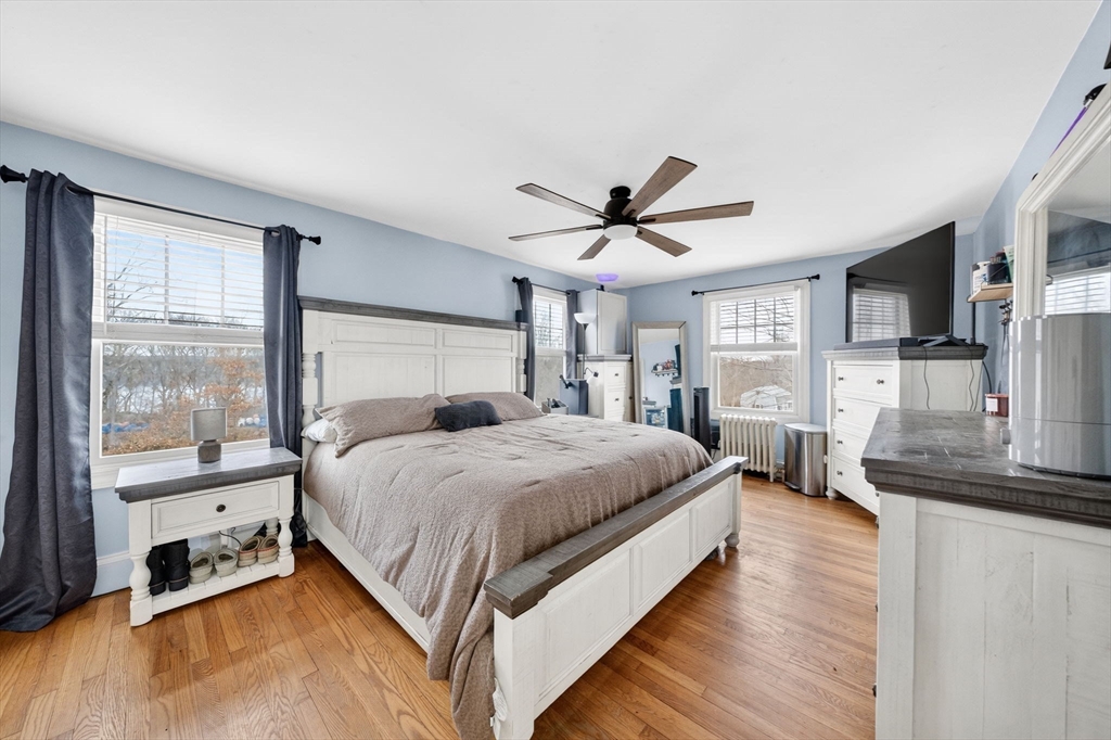 59 Glendale Street Fall River, MA 02720 - Photo 23 of 37 a bedroom with a bed a window and a flat screen television