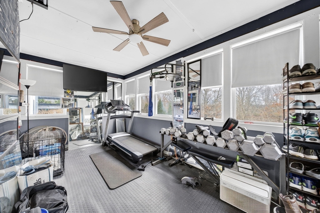 59 Glendale Street Fall River, MA 02720 - Photo 27 of 37 a living room with furniture gym equipment and a large window