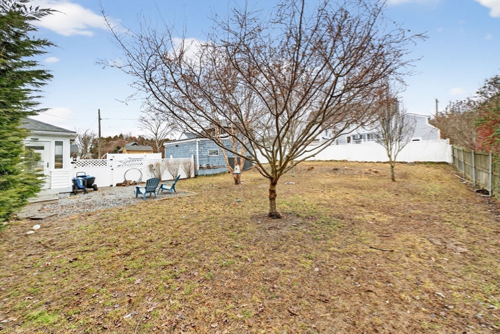 59 Glendale Street Fall River, MA 02720 - Photo 34 of 37 a view of a white house with a snow