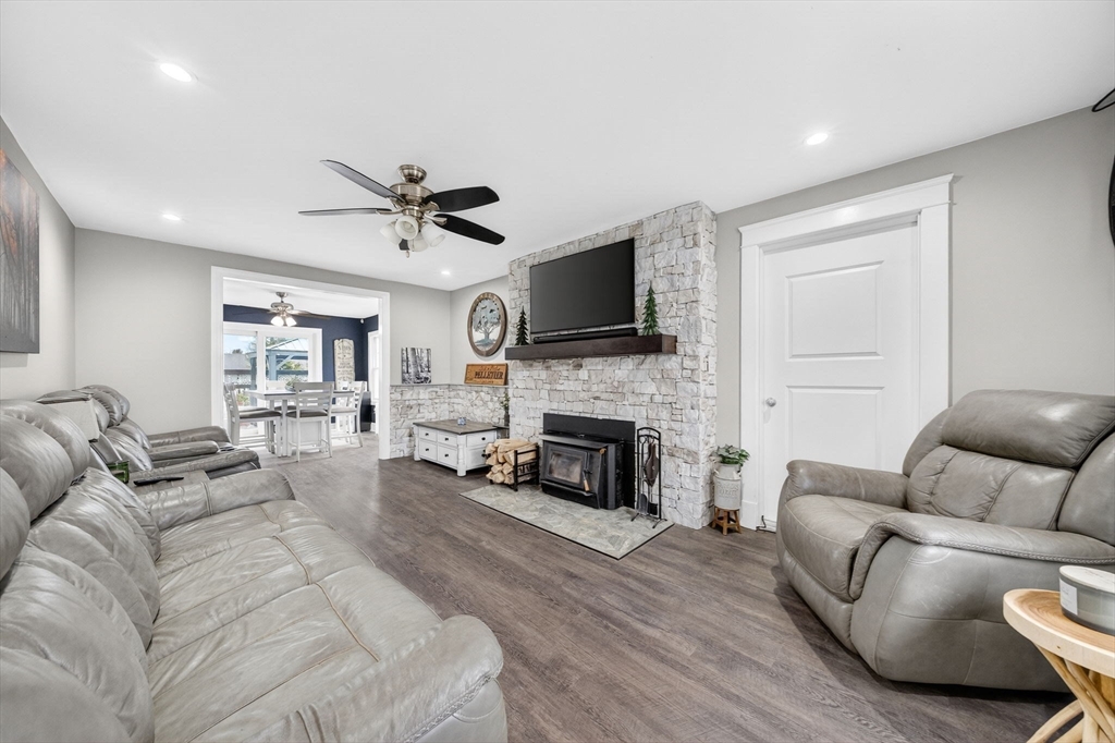 59 Glendale Street Fall River, MA 02720 - Photo 4 of 37 a living room with furniture fireplace and a flat screen tv