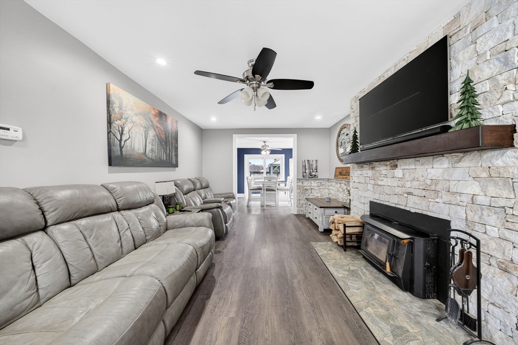 59 Glendale Street Fall River, MA 02720 - Photo 5 of 37 a living room with furniture a flat screen tv and a fireplace