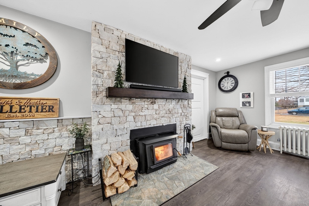 59 Glendale Street Fall River, MA 02720 - Photo 7 of 37 a living room with furniture a flat screen tv and a fireplace