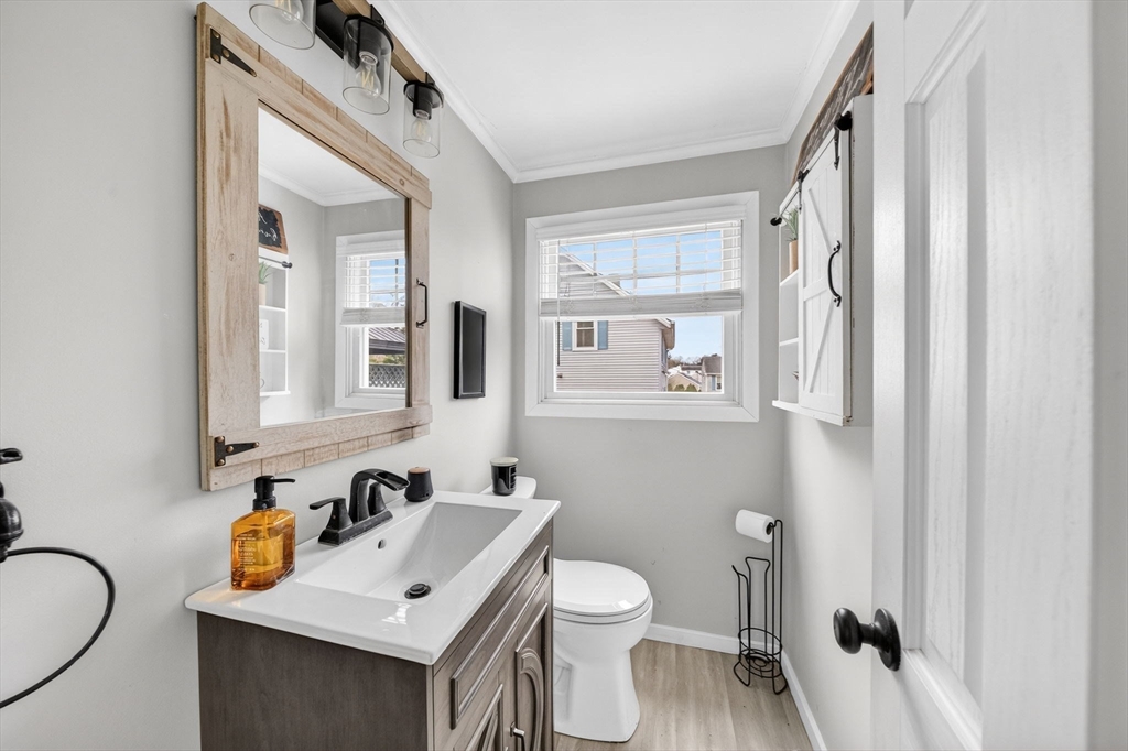 59 Glendale Street Fall River, MA 02720 - Photo 10 of 37 a bathroom with a sink vanity mirror and toilet