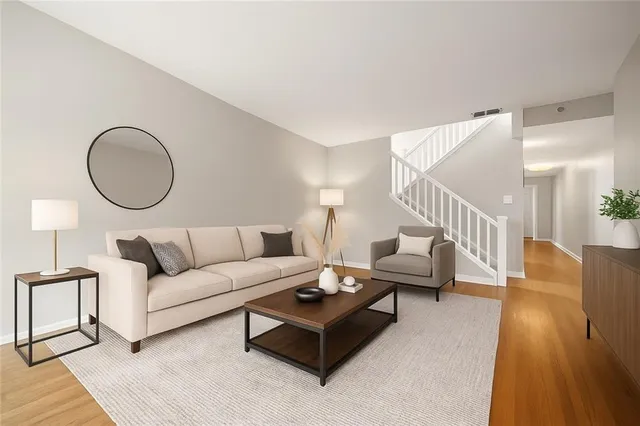 a living room with furniture and a lamp