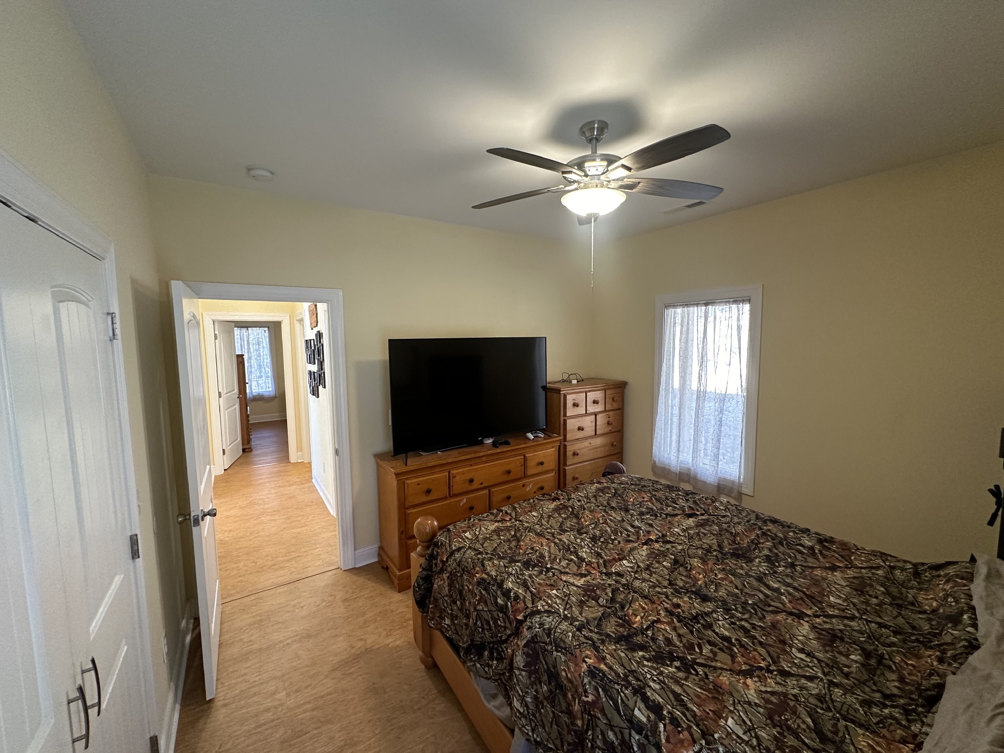 8427 Last Butler Creek Road Iron City, TN 38463 - Photo 15 of 50 a bedroom with a bed and a flat screen tv