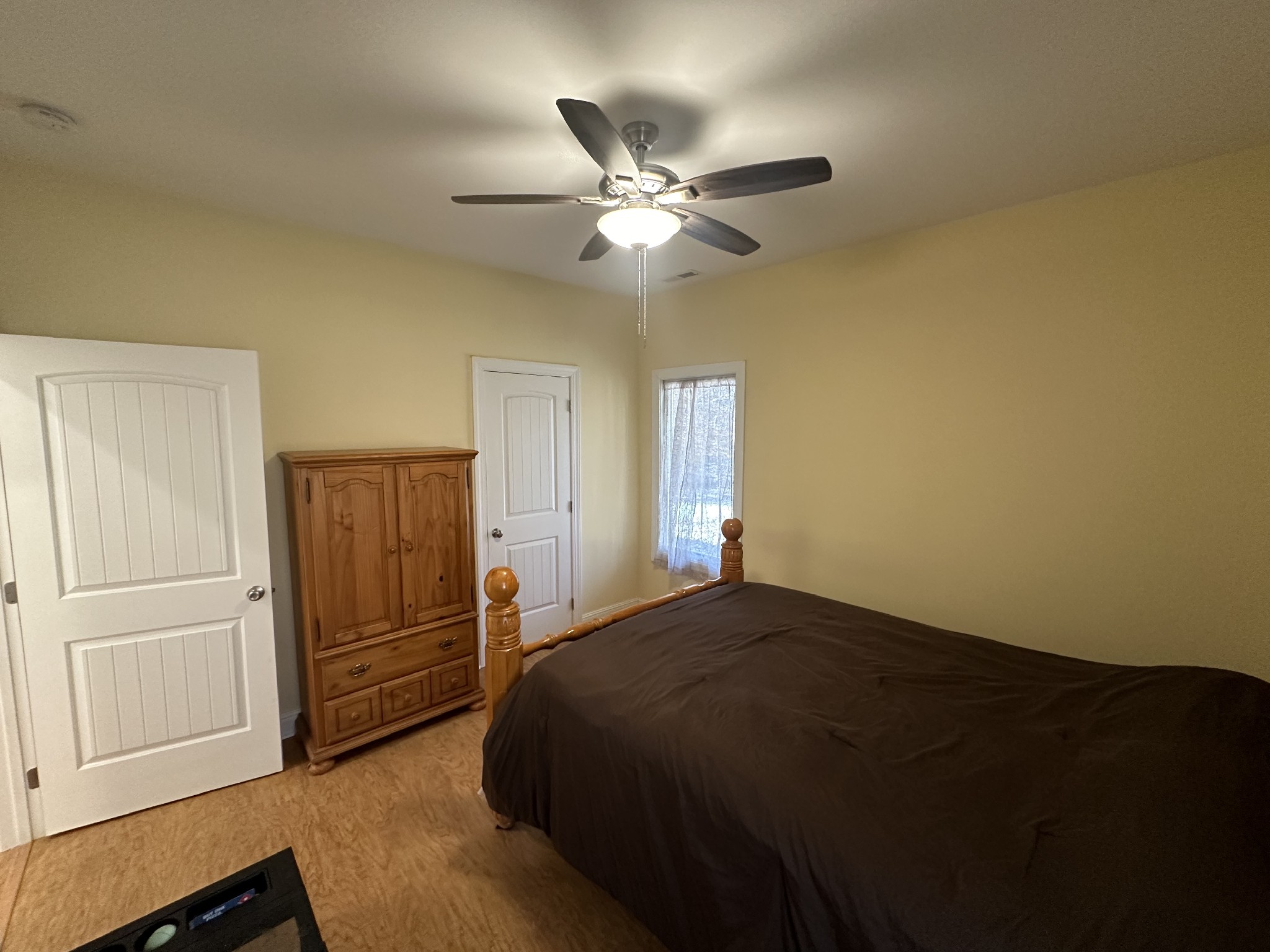 8427 Last Butler Creek Road Iron City, TN 38463 - Photo 17 of 50 a bedroom with a bed and a ceiling fan