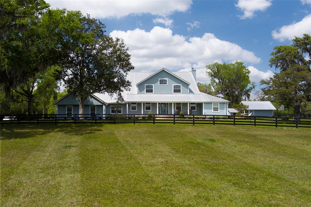 a front view of a house with swimming pool