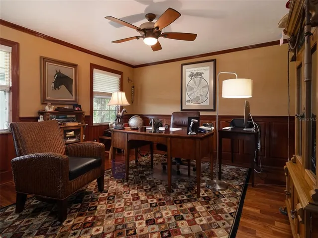 a living room with furniture a rug and a window