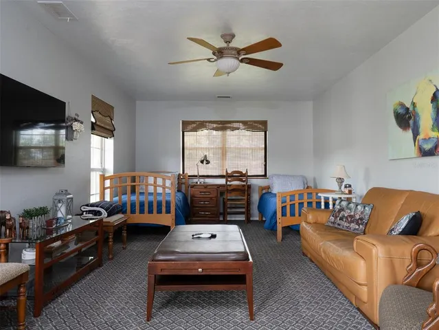 a bedroom with furniture and a window