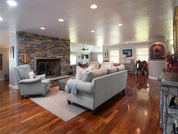 a living room with furniture and a fireplace