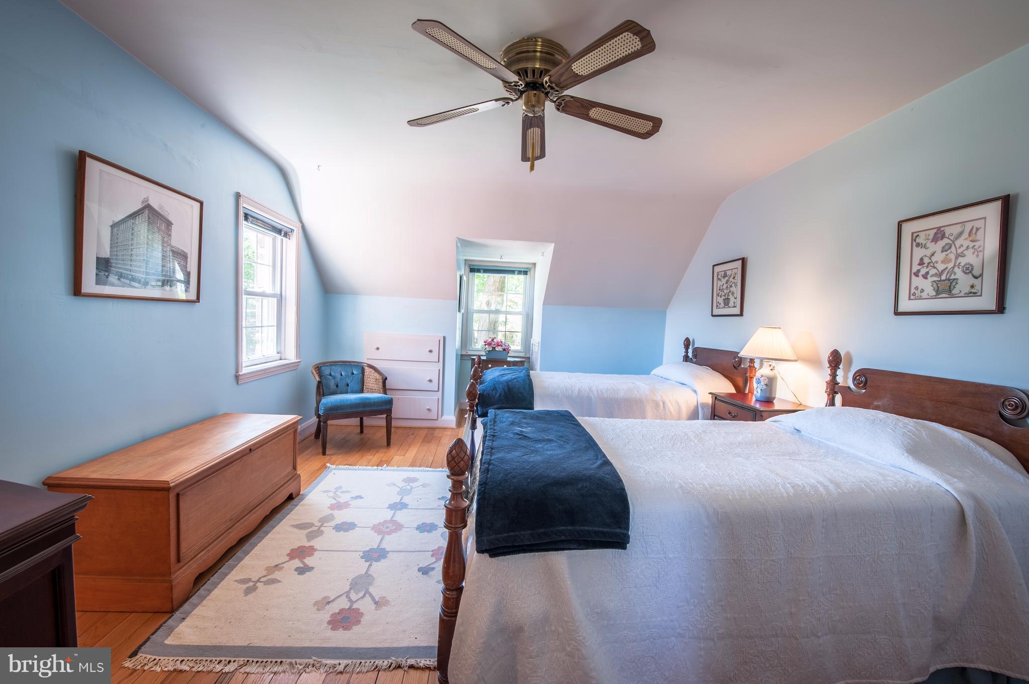 6507 Sharon Road Baltimore, MD 21239 - Photo 12 of 19 a bedroom with a bed and a chandelier