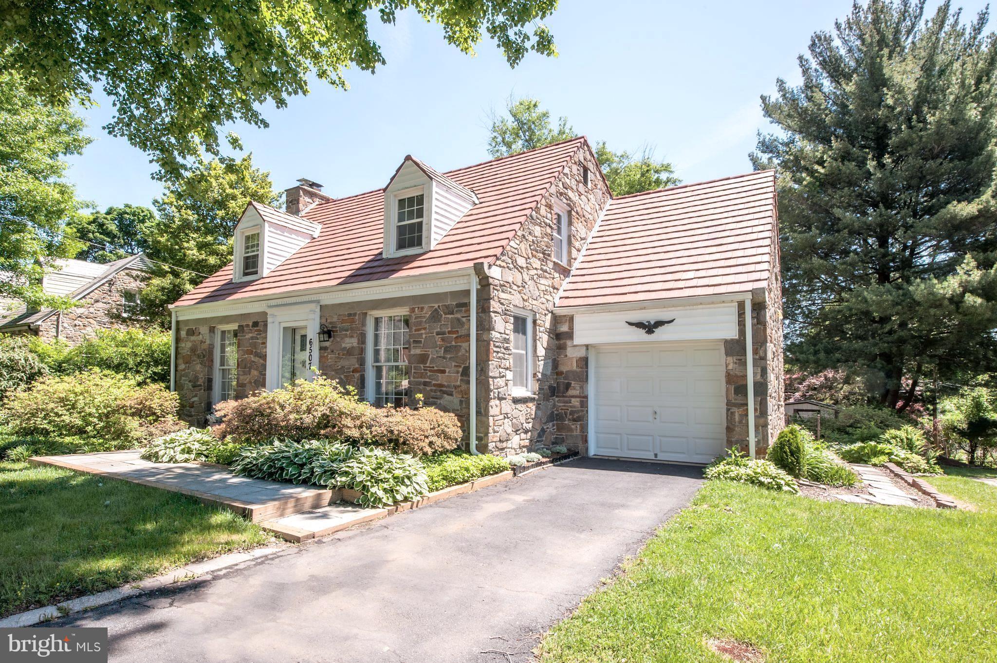 6507 Sharon Road Baltimore, MD 21239 - Photo 19 of 19 a front view of a house with garden