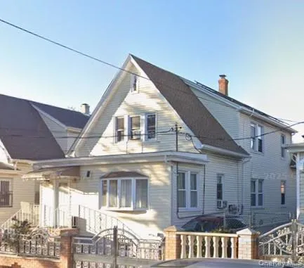 a view of a building next to a yard