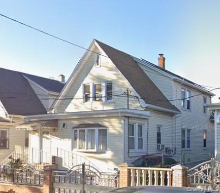 a view of a building next to a yard