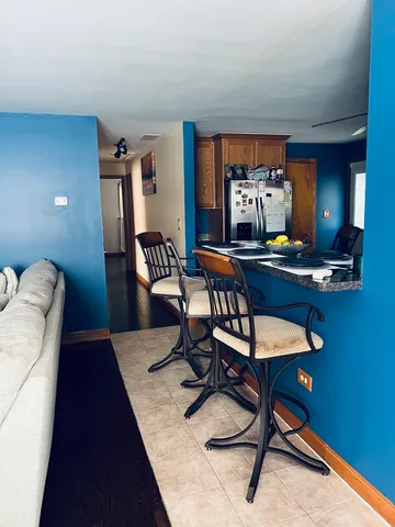 a view of a workspace with furniture