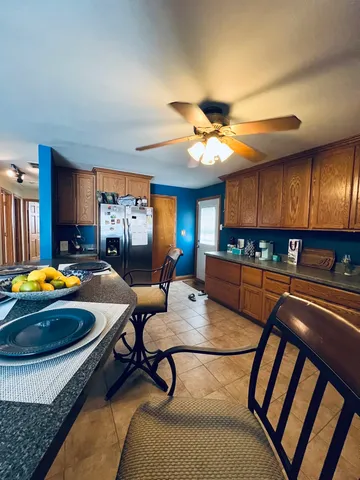 a bedroom with furniture and a chandelier