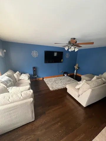 a bedroom with a bed and a night stand