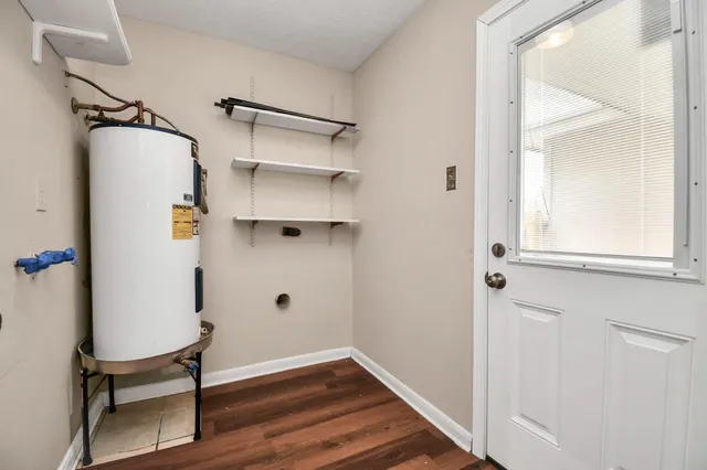 a view of a room with wooden floor and chair