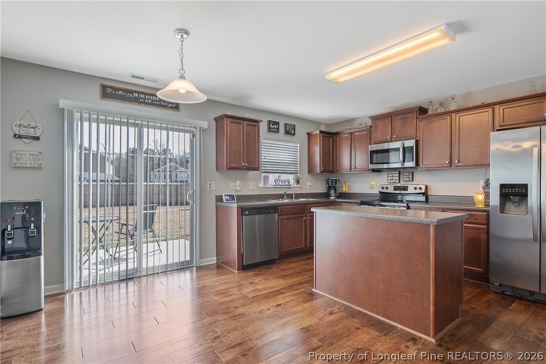 340 Battery Way Bunnlevel, NC 28323 - Photo 8 of 50 a kitchen with stainless steel appliances granite countertop a refrigerator a stove top oven a sink and dishwasher