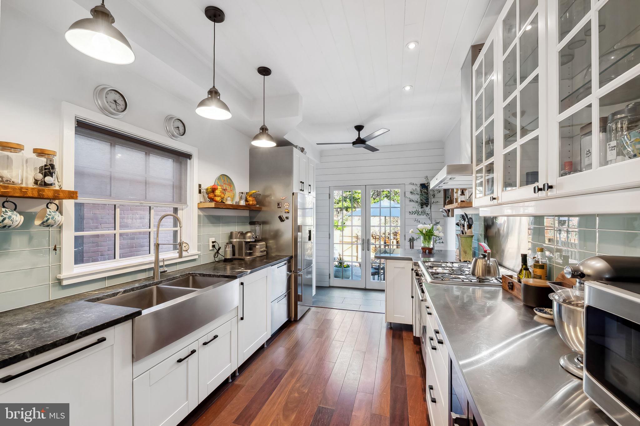 609 South Sharp Street Baltimore, MD 21230 - Photo 11 of 51 a large kitchen with stainless steel appliances lots of counter space and window