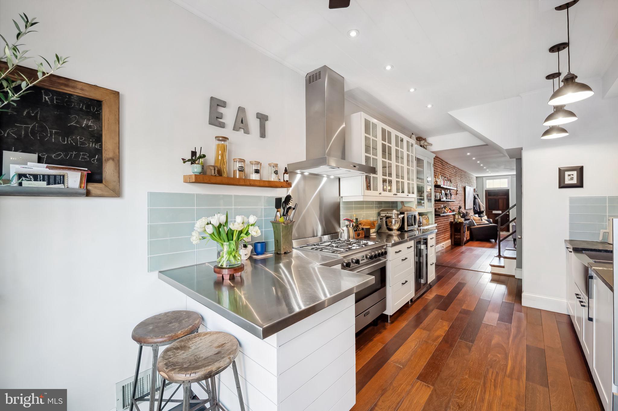 609 South Sharp Street Baltimore, MD 21230 - Photo 12 of 51 a view of a dining room with furniture wooden floor and a rug