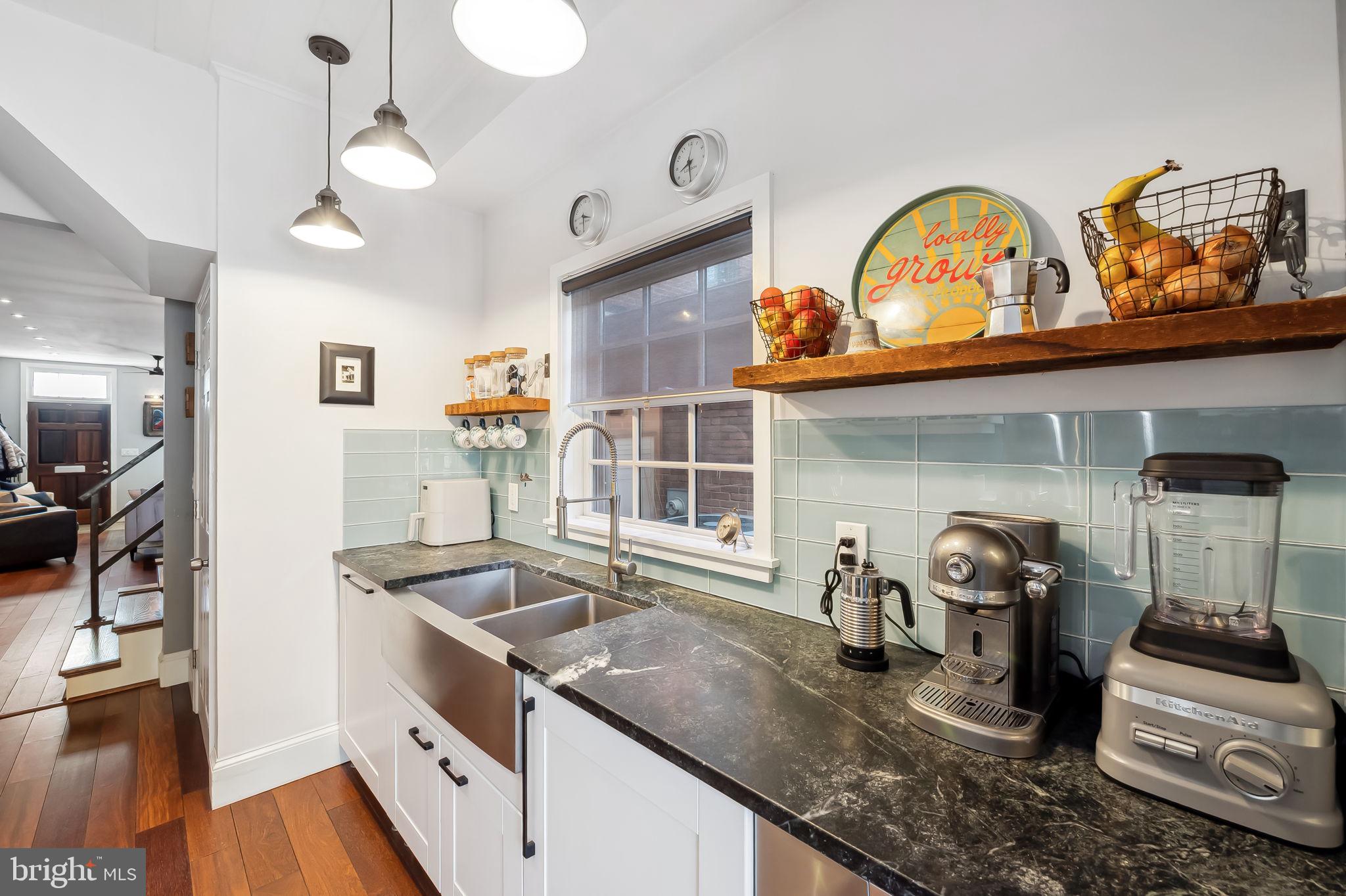 609 South Sharp Street Baltimore, MD 21230 - Photo 13 of 51 a kitchen with sink a stove and cabinets