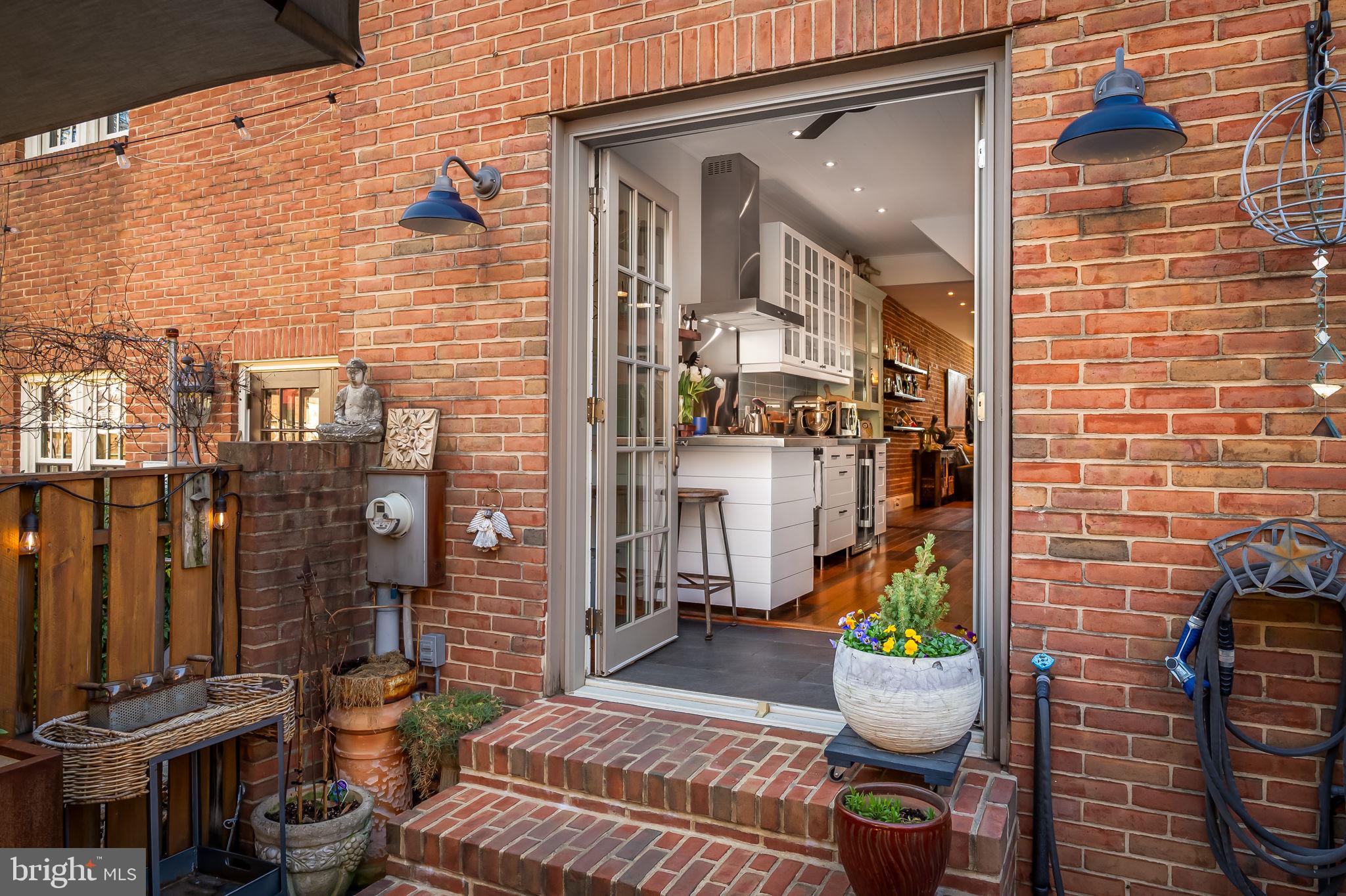 609 South Sharp Street Baltimore, MD 21230 - Photo 16 of 51 a view of a balcony with chairs and potted plants