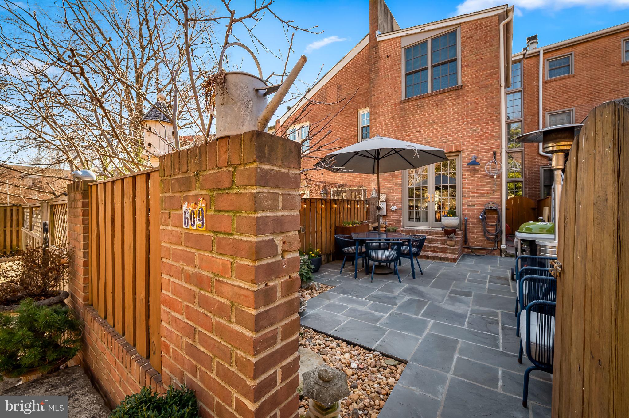 609 South Sharp Street Baltimore, MD 21230 - Photo 18 of 51 a view of a patio with a table and chairs under an umbrella