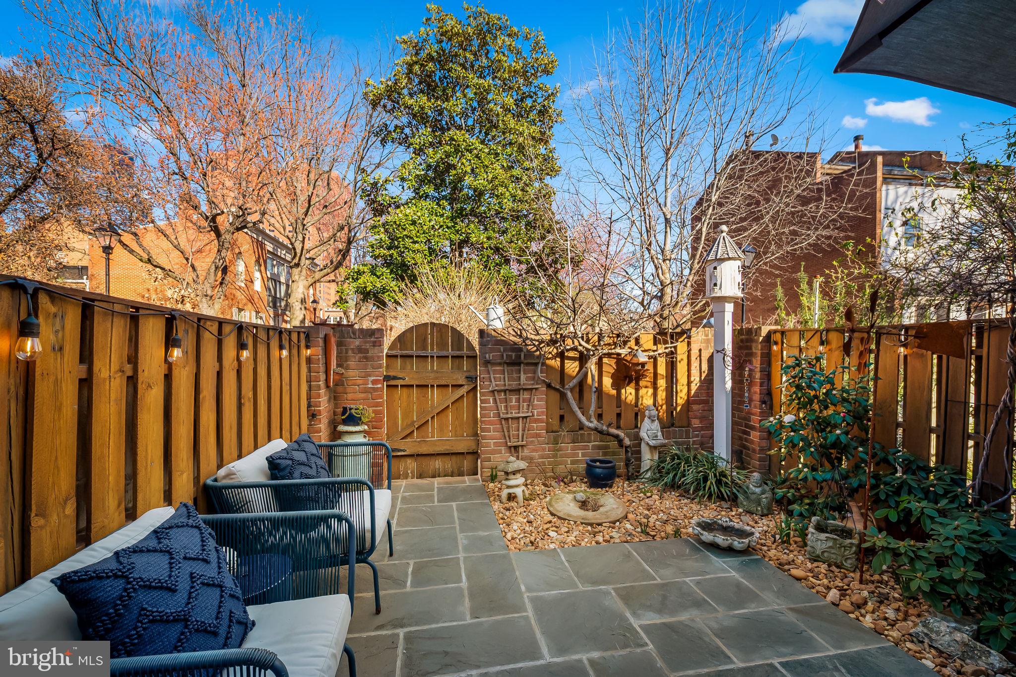 609 South Sharp Street Baltimore, MD 21230 - Photo 19 of 51 a view of a chairs and table in the back yard of the house