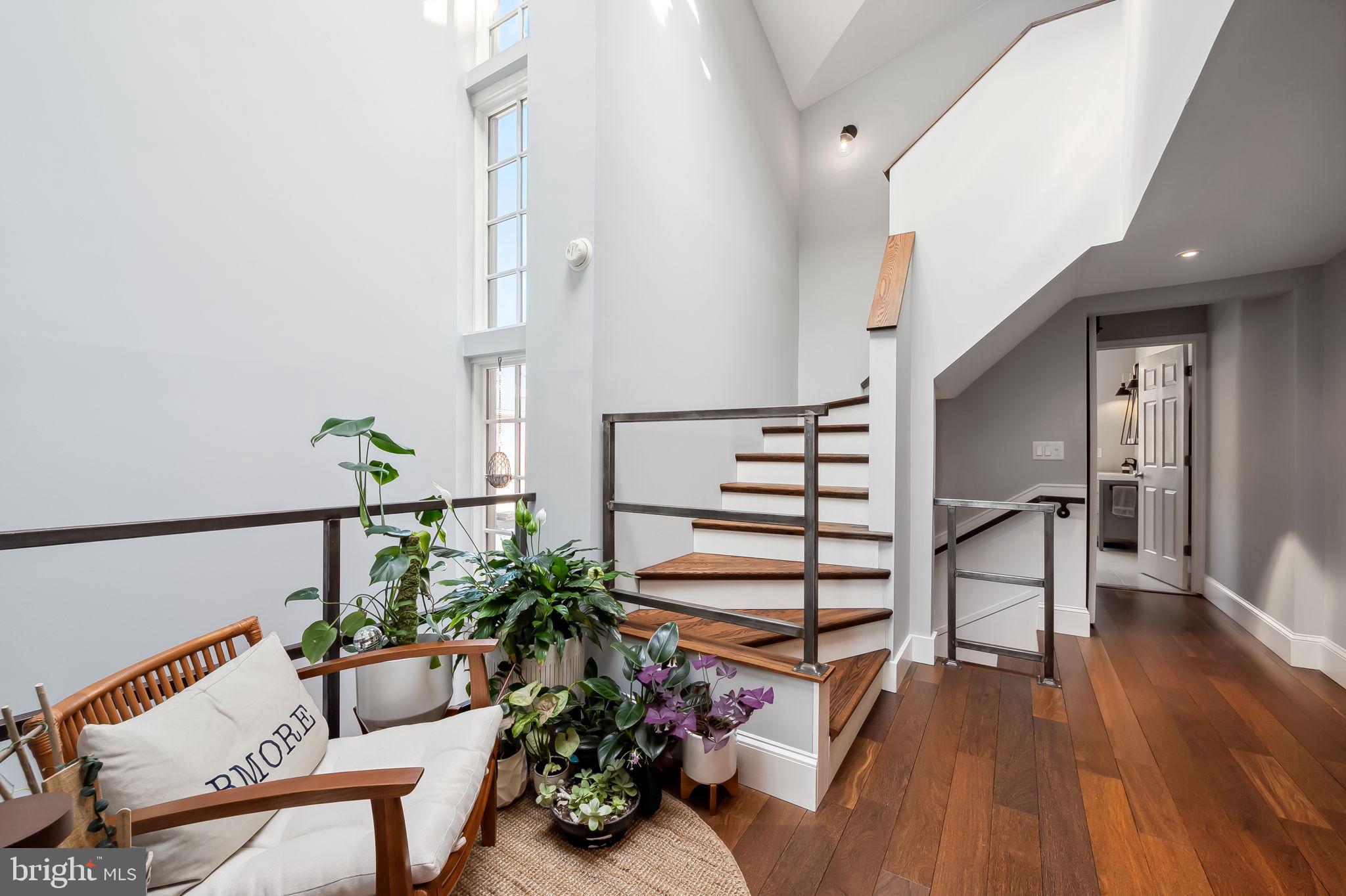 609 South Sharp Street Baltimore, MD 21230 - Photo 21 of 51 a view of entryway with wooden floor and stairs