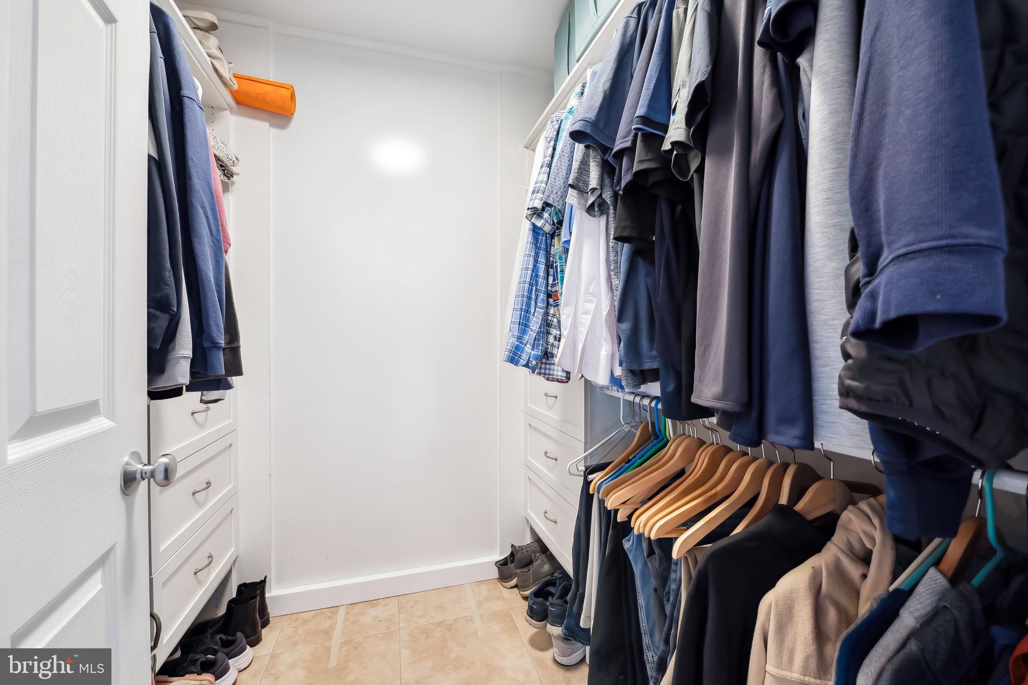 609 South Sharp Street Baltimore, MD 21230 - Photo 26 of 51 a view of walk in closet with clothes and shoes