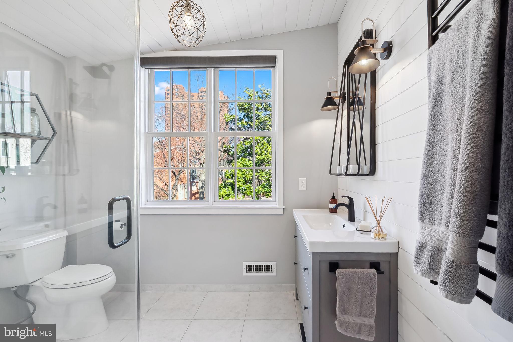 609 South Sharp Street Baltimore, MD 21230 - Photo 29 of 51 a bathroom with a sink a toilet and shower