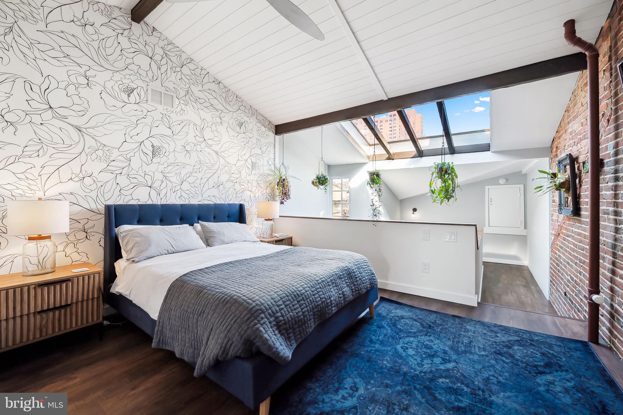 609 South Sharp Street Baltimore, MD 21230 - Photo 36 of 51 a bedroom with a large bed and a window