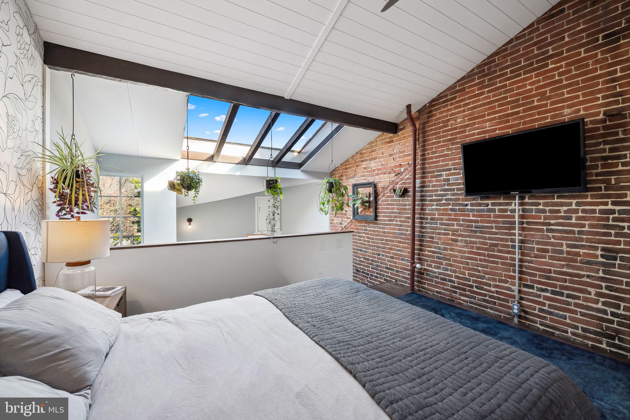 609 South Sharp Street Baltimore, MD 21230 - Photo 37 of 51 a bedroom with a bed and a flat screen tv