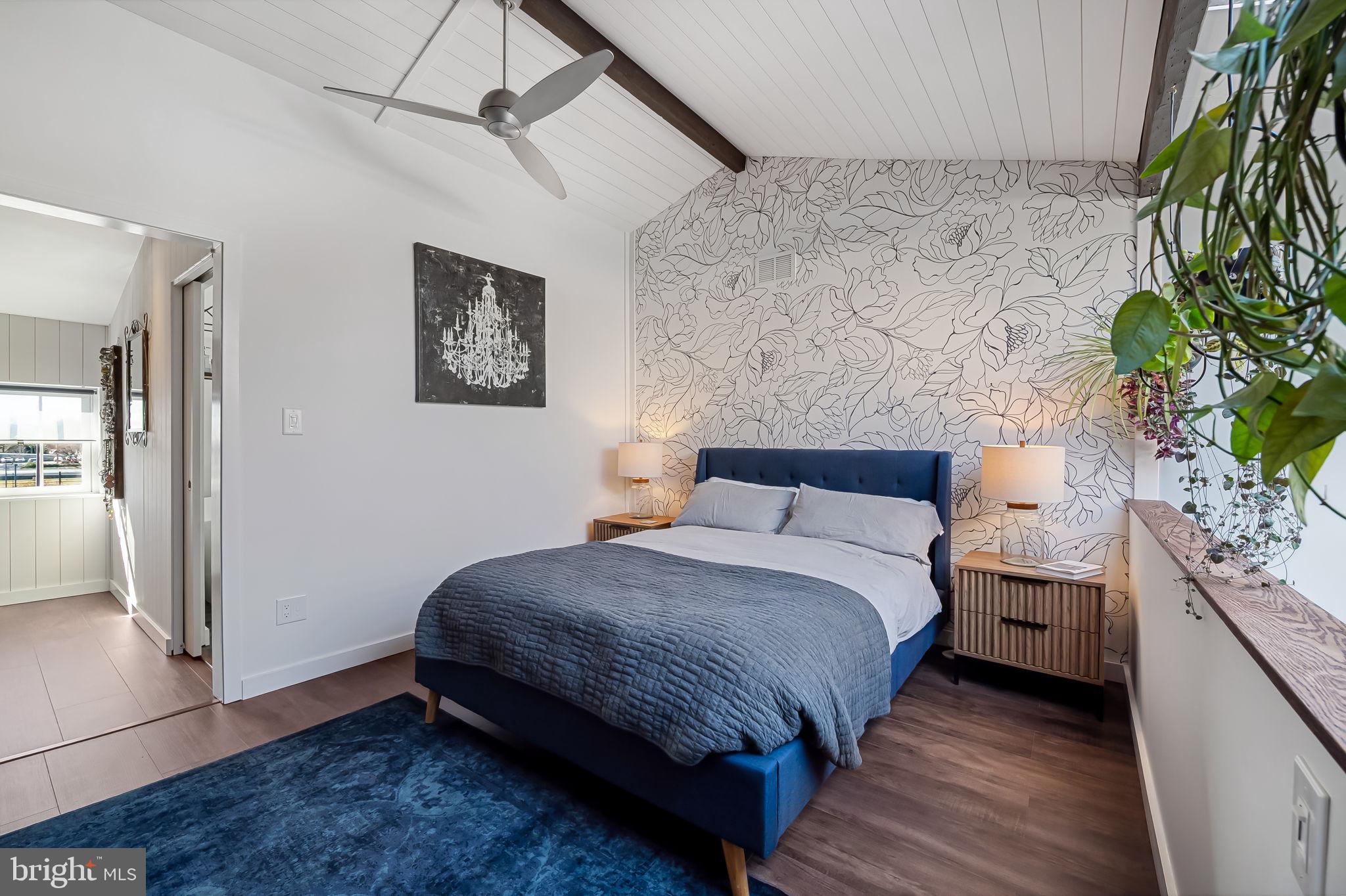 609 South Sharp Street Baltimore, MD 21230 - Photo 38 of 51 a bedroom with a bed and a potted plant