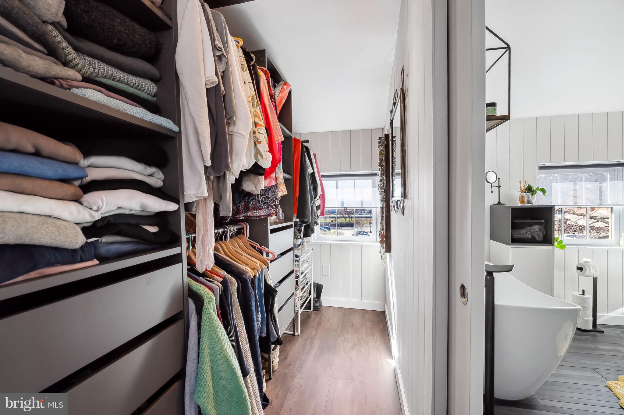 609 South Sharp Street Baltimore, MD 21230 - Photo 39 of 51 a view of walk in closet with clothes and shoes
