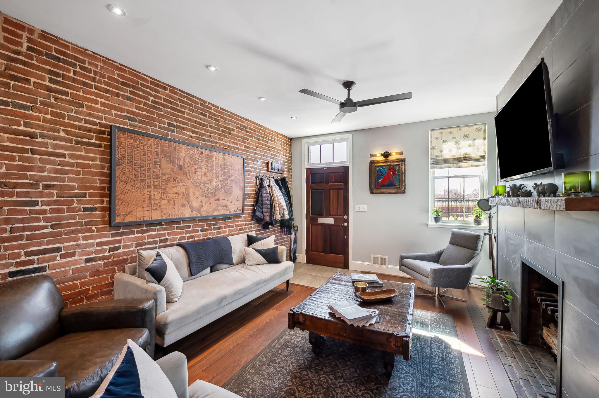 609 South Sharp Street Baltimore, MD 21230 - Photo 4 of 51 a living room with furniture a flat screen tv and a fireplace