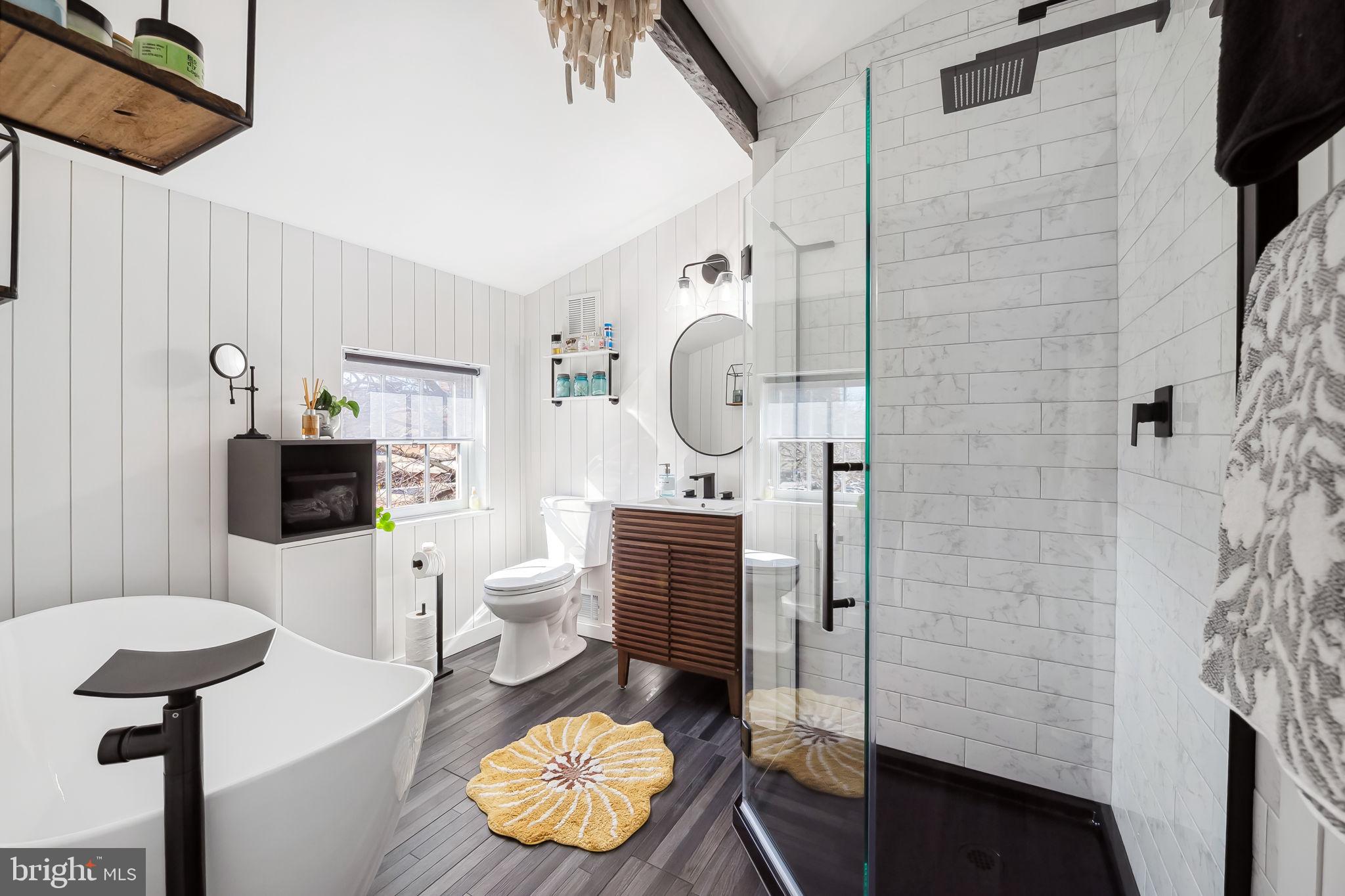 609 South Sharp Street Baltimore, MD 21230 - Photo 41 of 51 a bathroom with a toilet a sink and a mirror