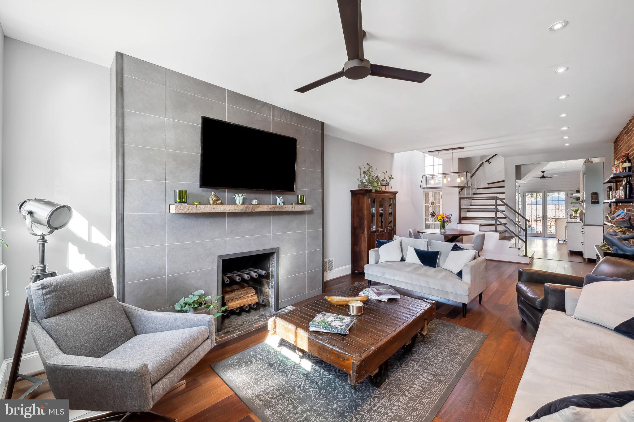 609 South Sharp Street Baltimore, MD 21230 - Photo 7 of 51 a living room with furniture a flat screen tv and a fireplace