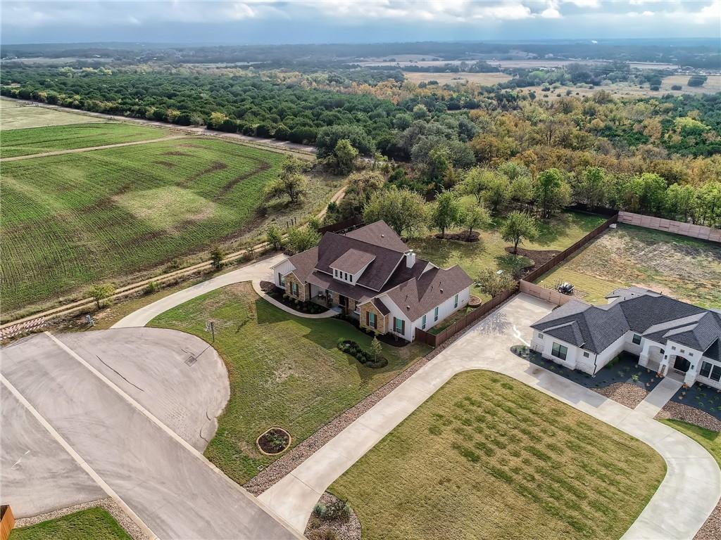 132 Huerta Road Florence, TX 76527 - Photo 38 of 40 Discover two distinguished residences nestled amidst sprawling fields and abundant natural beauty.