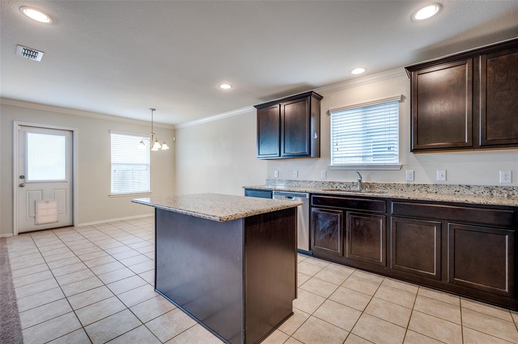 1420 Rivers Creek Lane Little Elm, TX 75068 - Photo 6 of 25 a kitchen with a sink and cabinets
